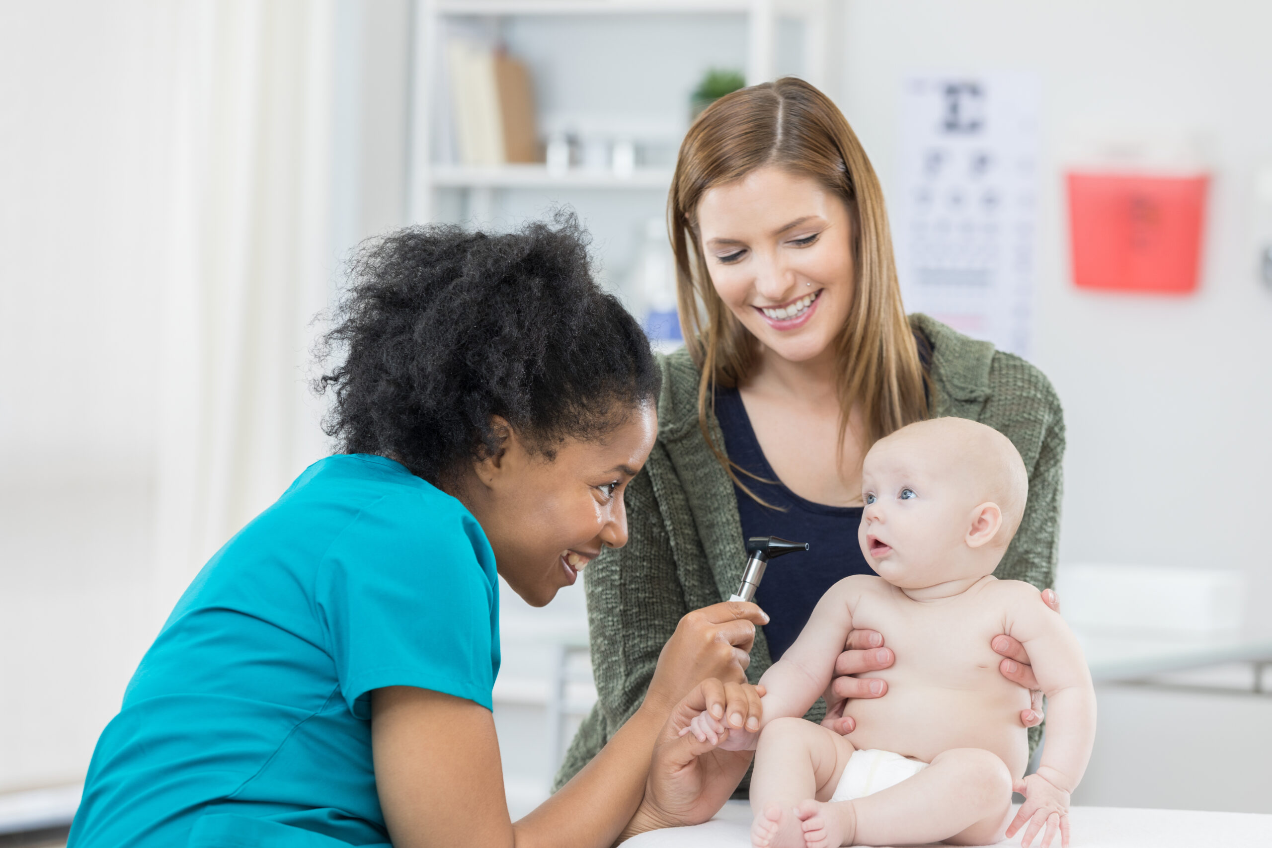A doctor examines and infant