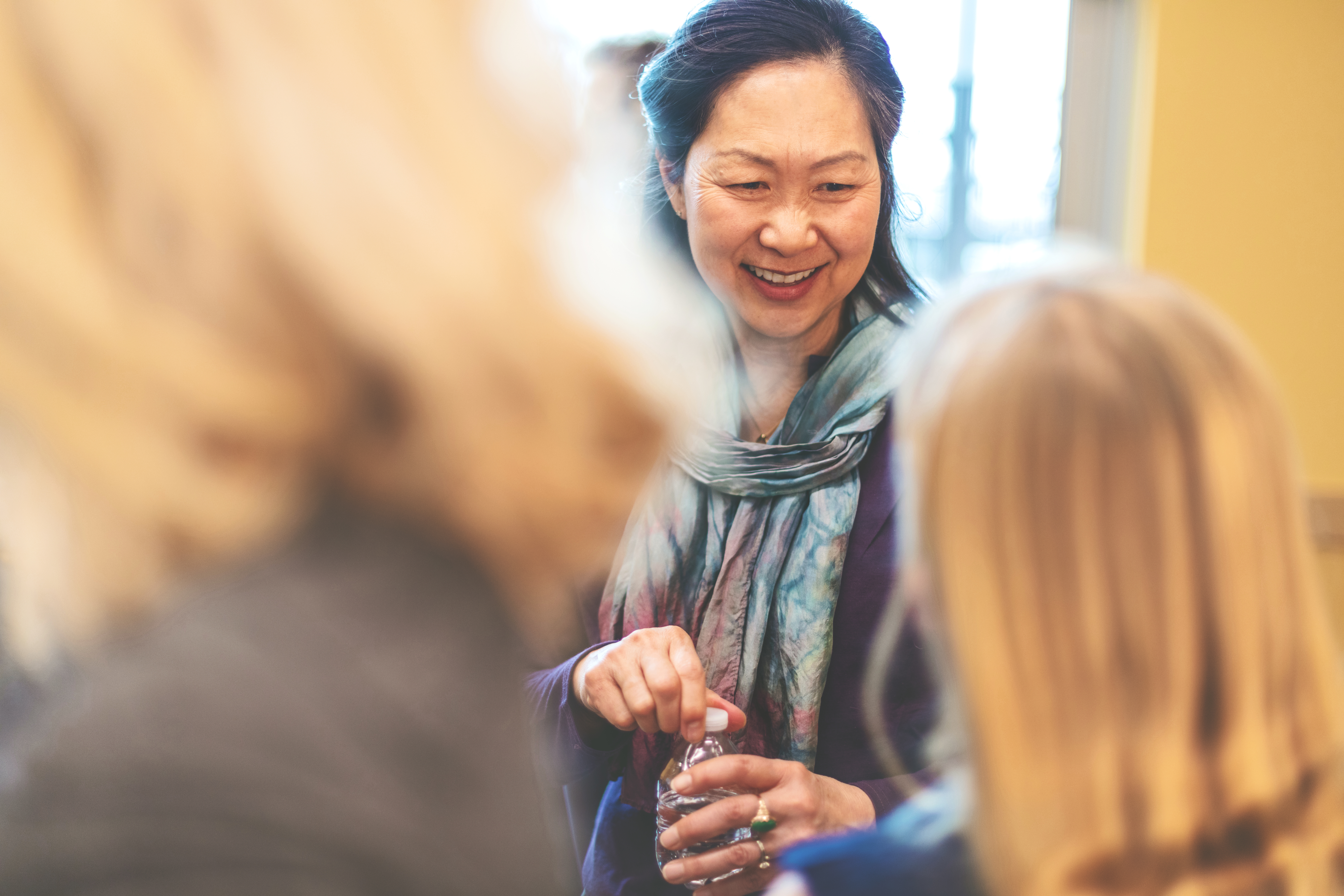 Woman smiling at community gathering