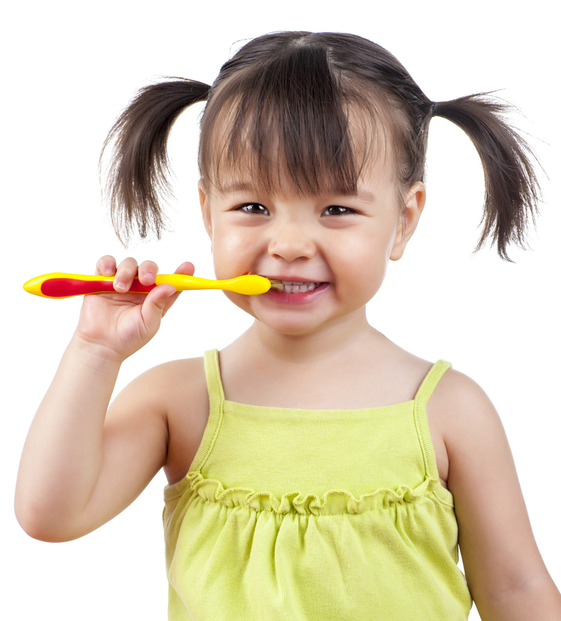 Child holding toothbrush and smiling